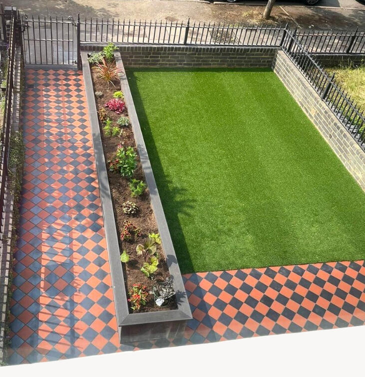 Newly installed modern sandstone paving and seating area in a Northampton garden by N&P Landscaping
